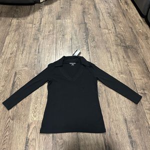 Women's size extra small, brand new, Geoffrey Beene Sport long sleeved black top